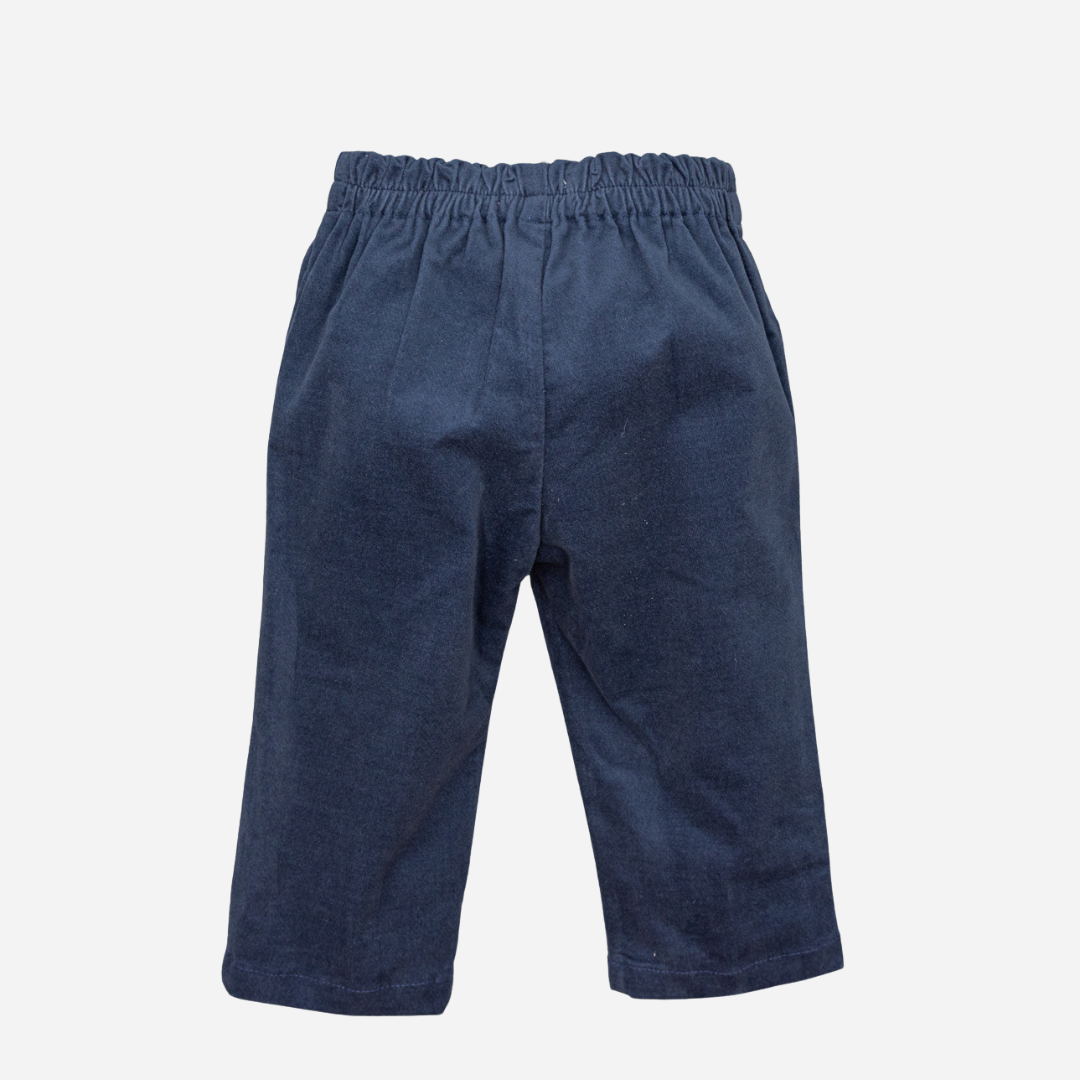 Sold at Bombon shop, designed by Fina Ejerique, navy velvet baby trousers with elasticated waistband and side pockets. back