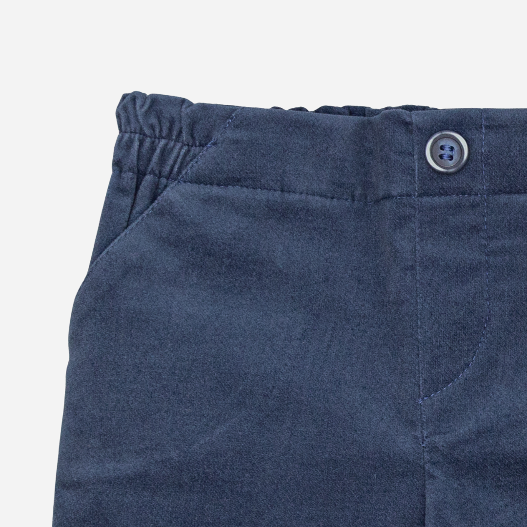 Sold at Bombon shop, designed by Fina Ejerique, navy velvet baby trousers with elasticated waistband and side pockets. zoom