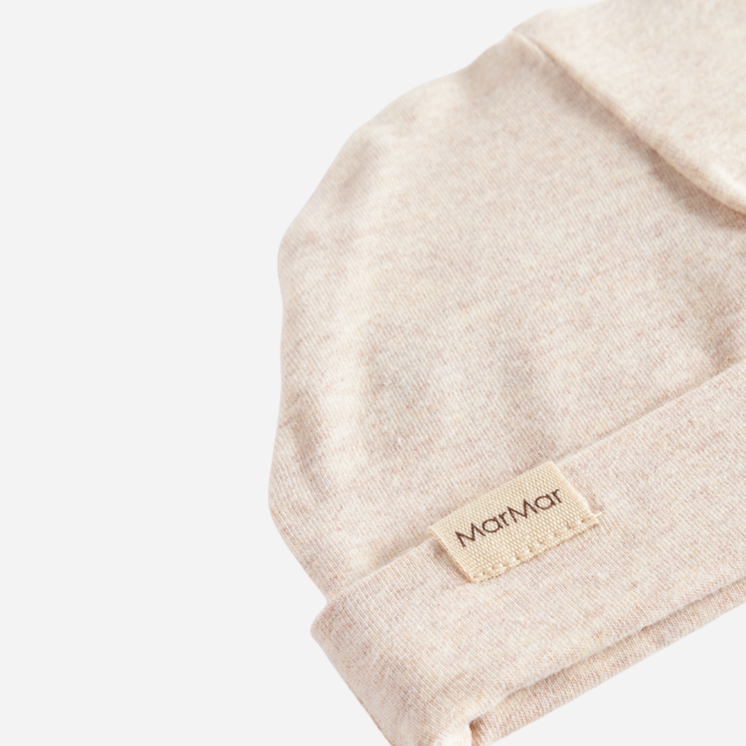Sold at Bombon shop, designed by MarMar Copenhagen — beige organic cotton baby hat with fold-over brim.