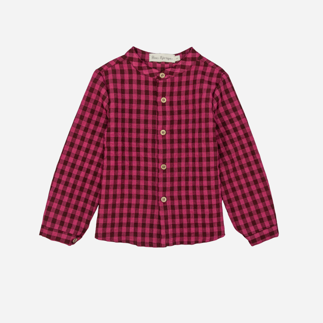 Sold at Bombon shop, designed by Fina Ejerique, a burgundy and black checkered cotton shirt with wooden buttons and long sleeves, styled to pair with the burgundy dog sweater. front