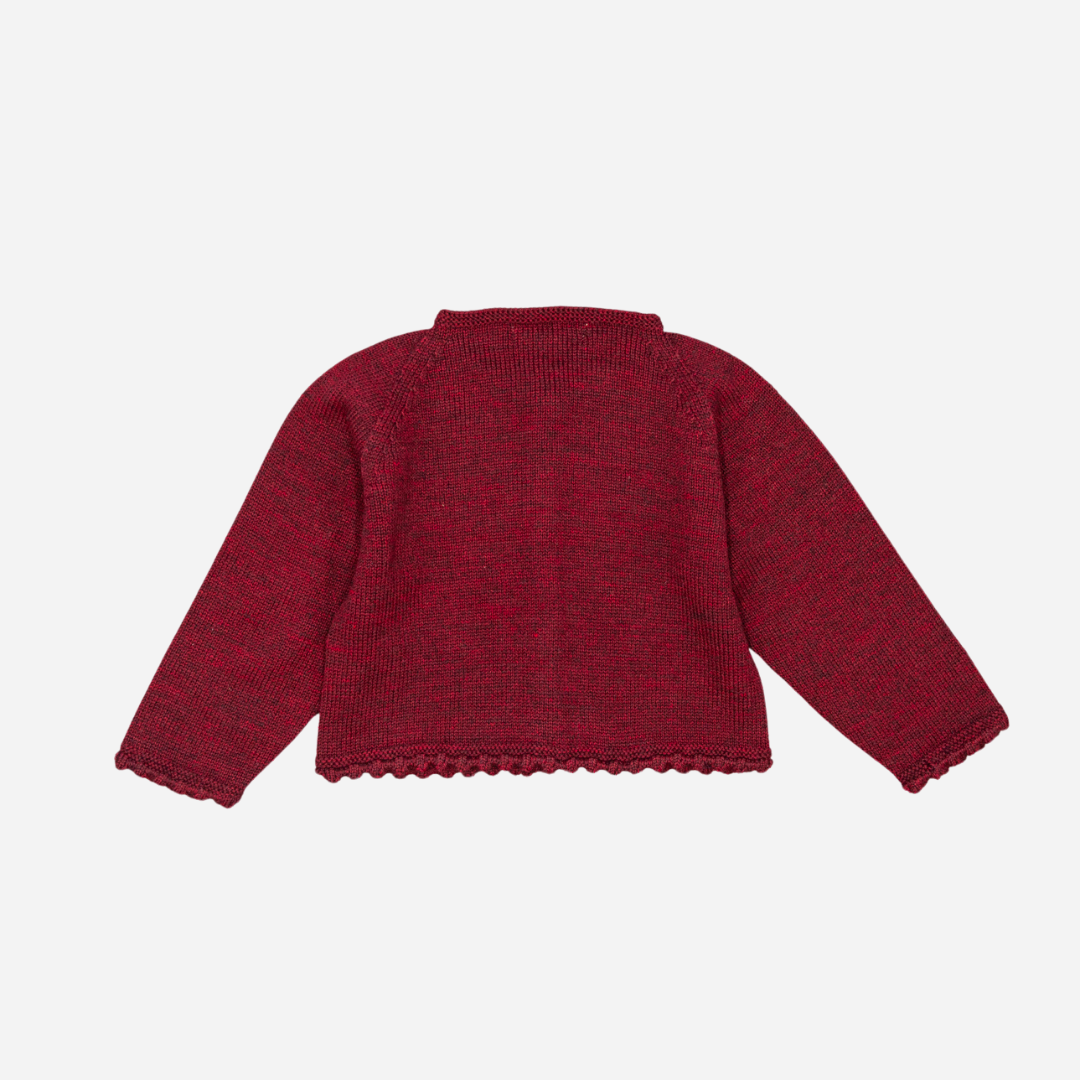 Sold at Bombon shop, designed by Fina Ejerique, a burgundy knit baby cardigan with wooden buttons and scalloped trim. back