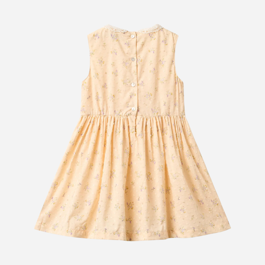 Sold at Bombon Shop, designed by Wheat, barely apricot flowers organic cotton sleeveless dress with soft gathered skirt.