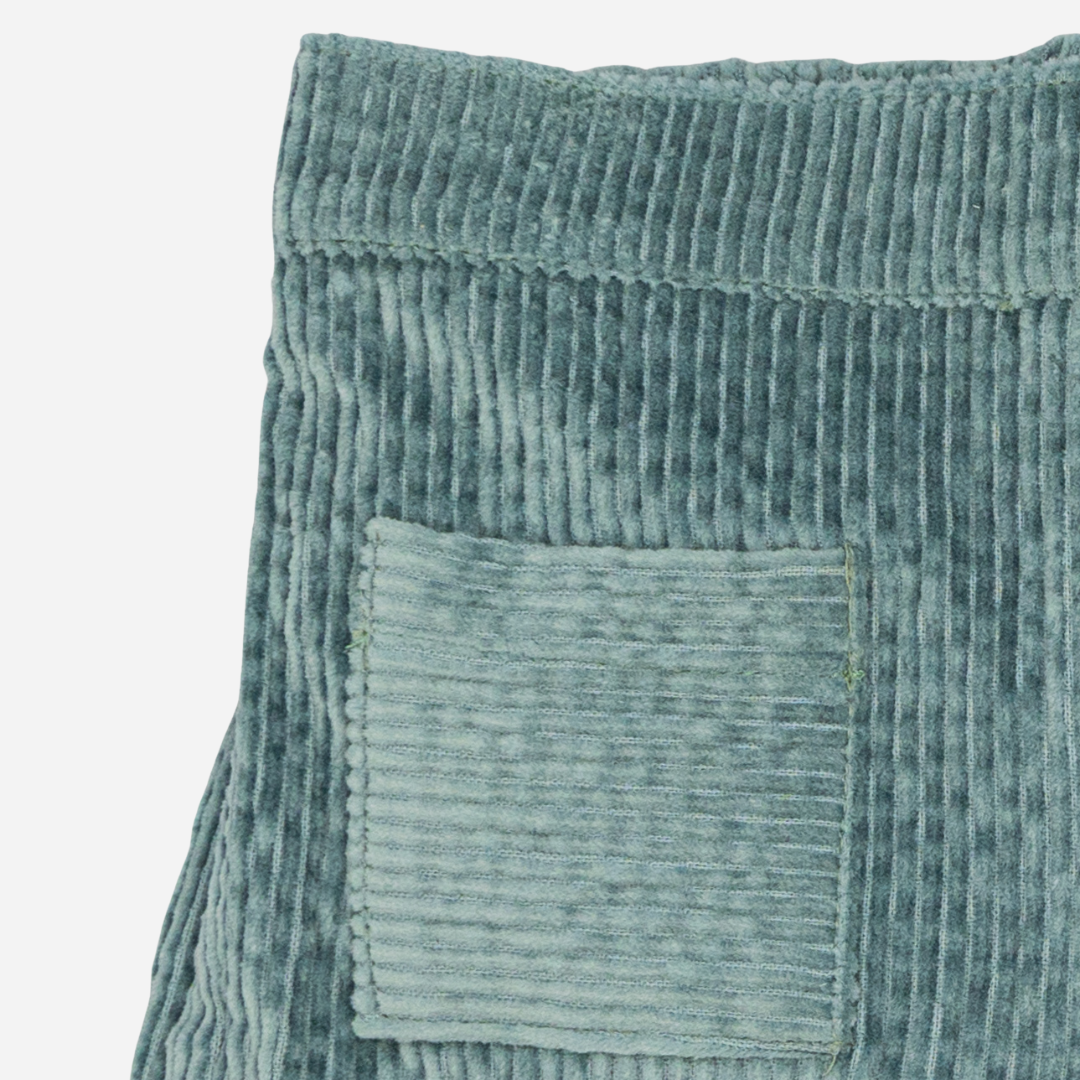 Sold at Bombon shop, designed by Fina Ejerique, green corduroy shorts with back pockets and bow detail, pairs perfectly with the green floral viyella blouse. zoom
