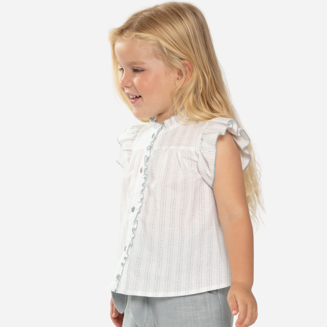 sold at Bombon shop, designed by Fina Ejerique brand, white and green flower blouse for babies and toddlers is perfect for summer. model view