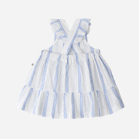 Sold at Bombon Shop, designed by 1+ in the family, ultramarine striped baby dress with adjustable straps and softly gathered skirt.