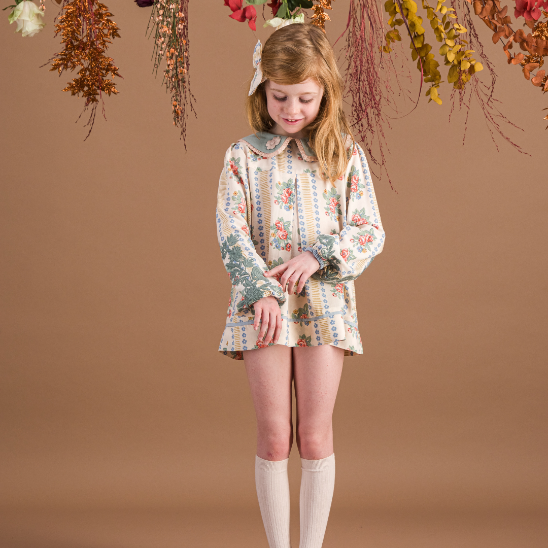 sold at Bombon shop, designed by Bachaa Blouse, 100% ECOVERO® Viscose, Block Print, Hand embroidered and lace trimmed collar, Hand embroidery on the sleeves, Contrasting tape, Gathers at the front and back, Long elasticated sleeves, Contrasting buttons and yoke at the back. model view