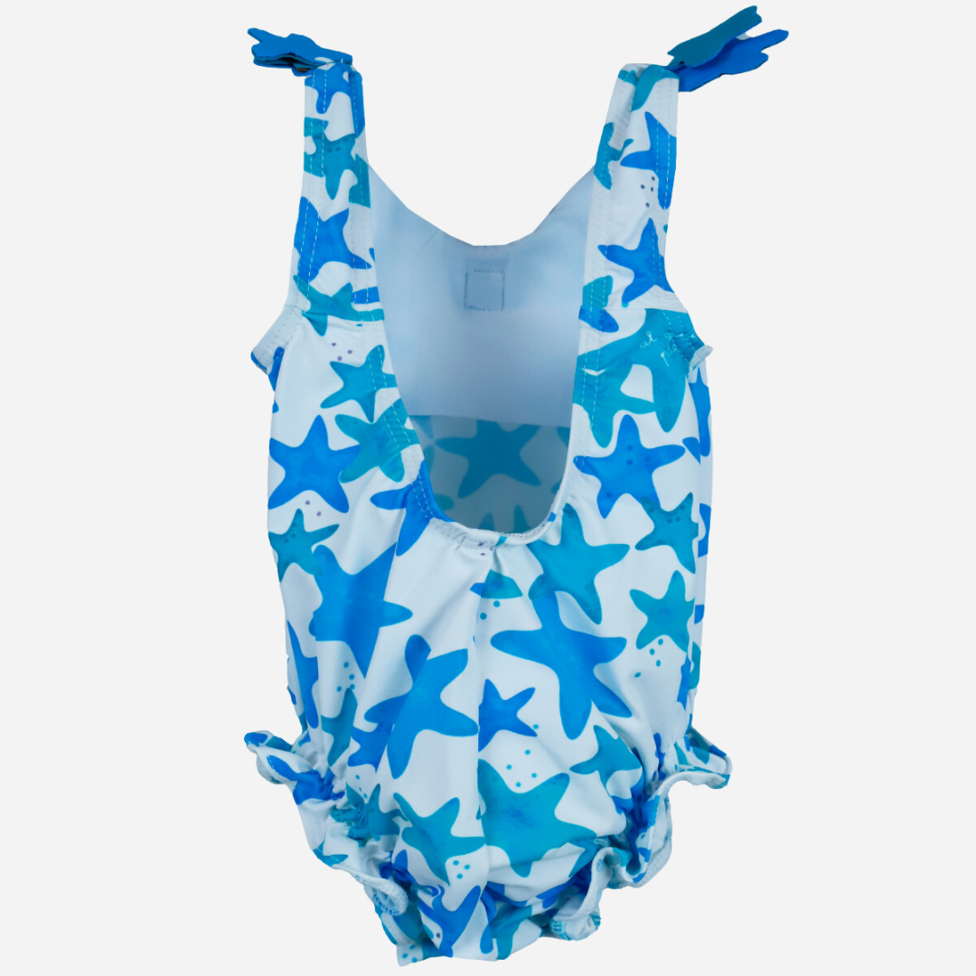 sold at Bombon shop, designed by Al Agua Patos Brand, this star print baby one piece swim suit in blue is perfect for summer. Back view