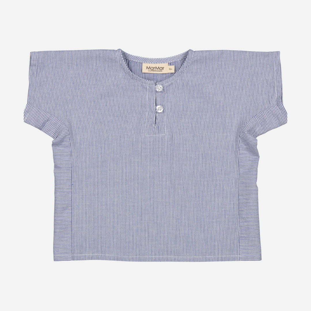 Sold at Bombon shop, designed by Mar Mar Copenhagen brand, this thin blue stripe shirt for baby boys and toddlers is perfect for spring and summer.