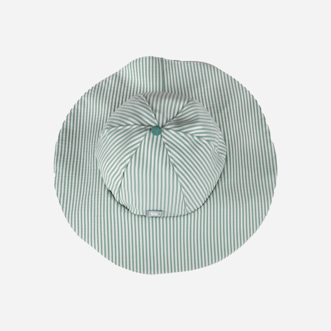 sold at Bombon shop, designed by Al Agua Patos Brand, this green and white striped hat provides sun coverage and is waterproof. Perfect for summer. top view