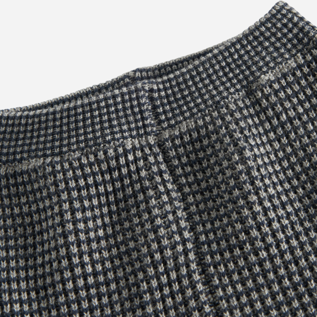 Sold at Bombon shop, designed by MarMar Copenhagen. Blue and beige textured knit baby pants with ribbed cuffs, pair perfectly with the matching knit sweater.