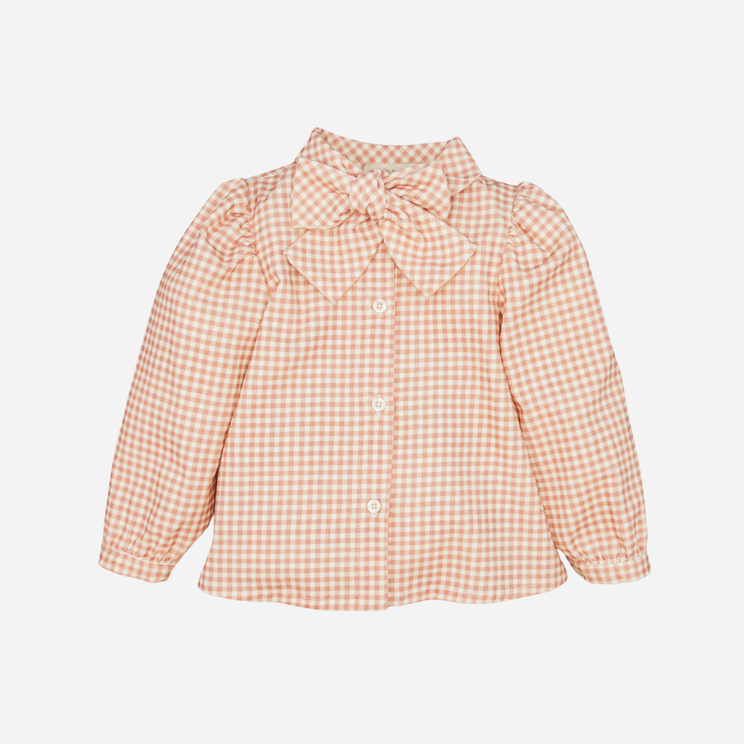 Sold at Bombon shop, designed by Fina Ejerique, pink gingham corduroy blouse with bow collar and puffed shoulders, styled to pair with the matching pants. front