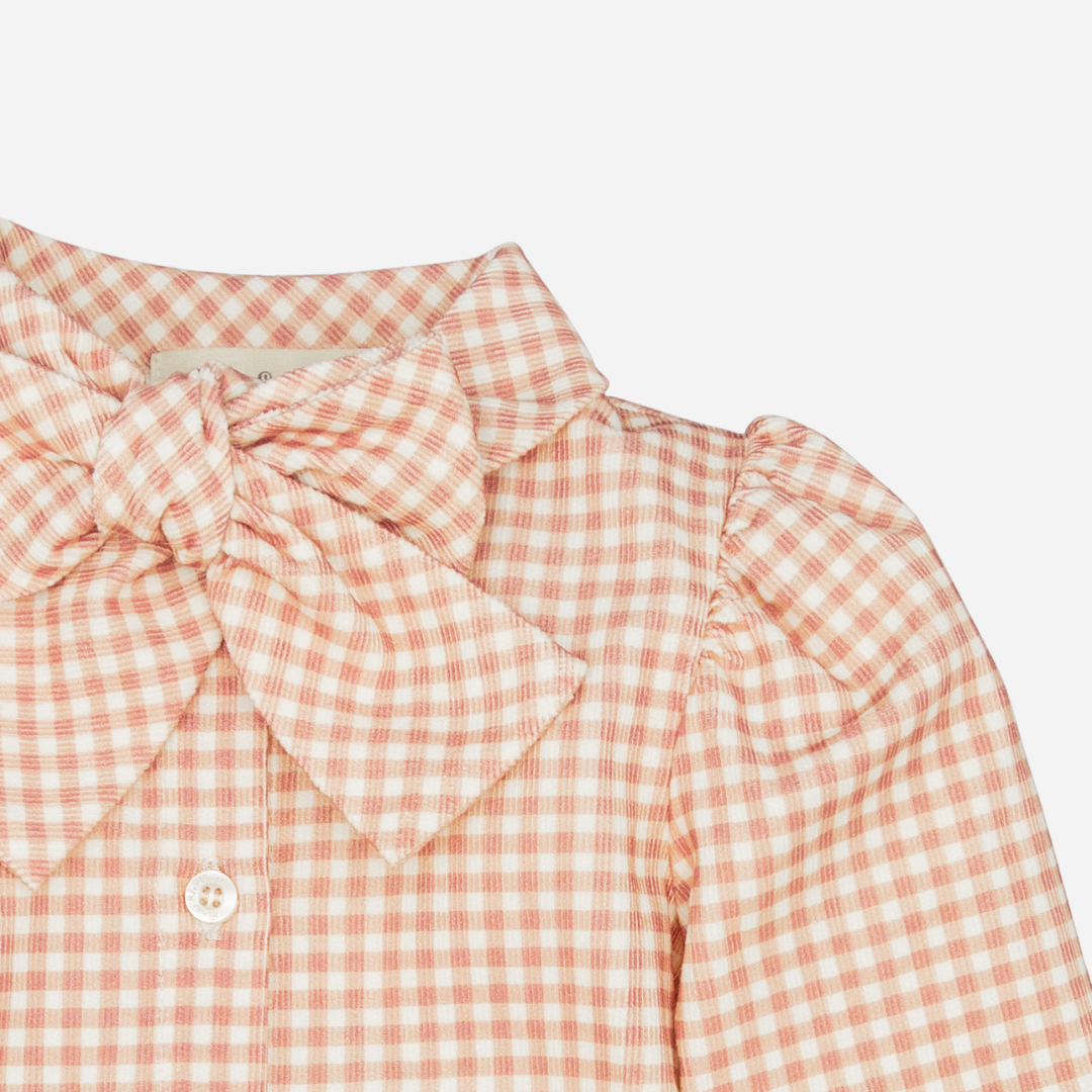 Sold at Bombon shop, designed by Fina Ejerique, pink gingham corduroy blouse with bow collar and puffed shoulders, styled to pair with the matching pants. zoom