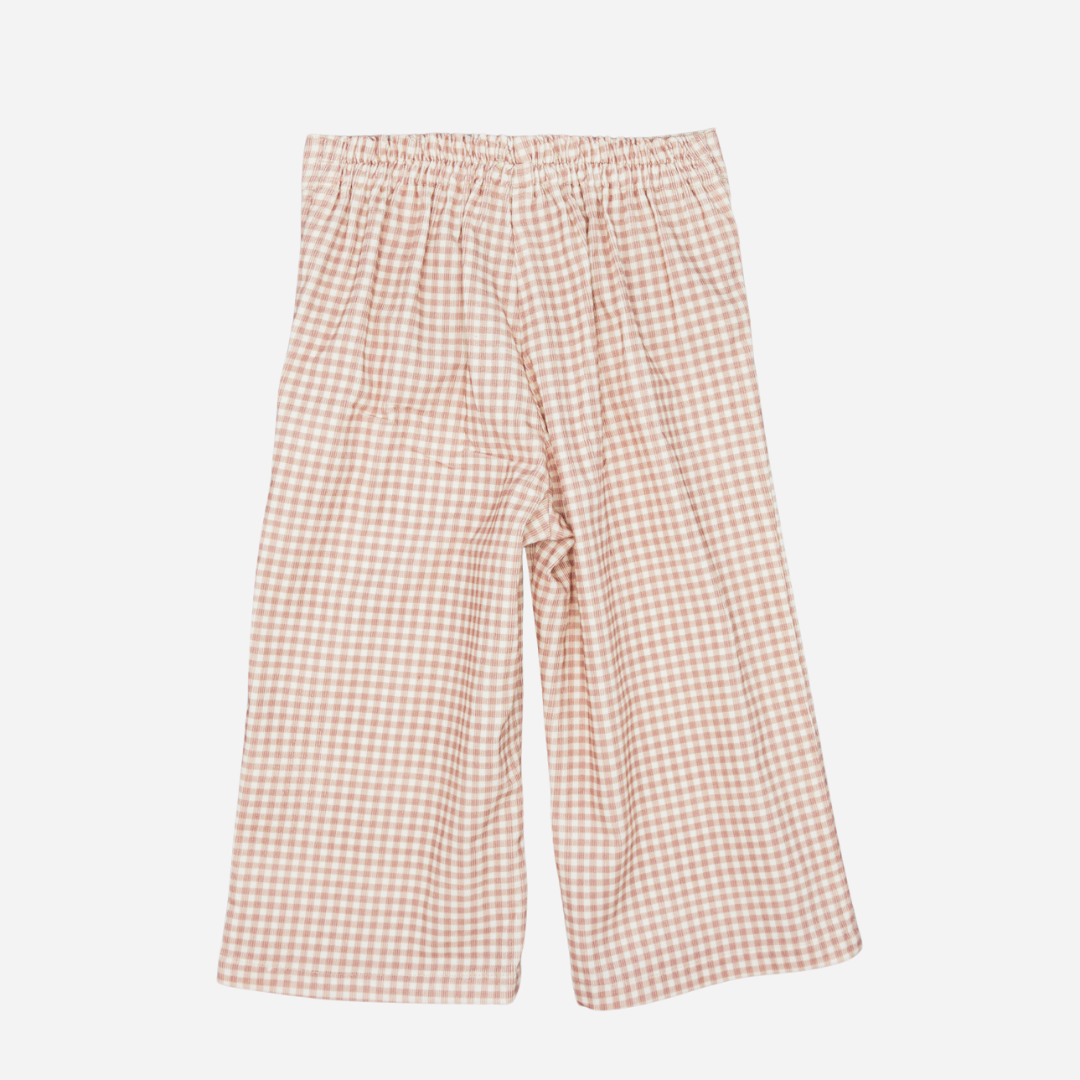 Sold at Bombon shop, designed by Fina Ejerique, pink gingham corduroy baby pants with ric-rac trim on the back pockets, styled to pair with the matching blouse.