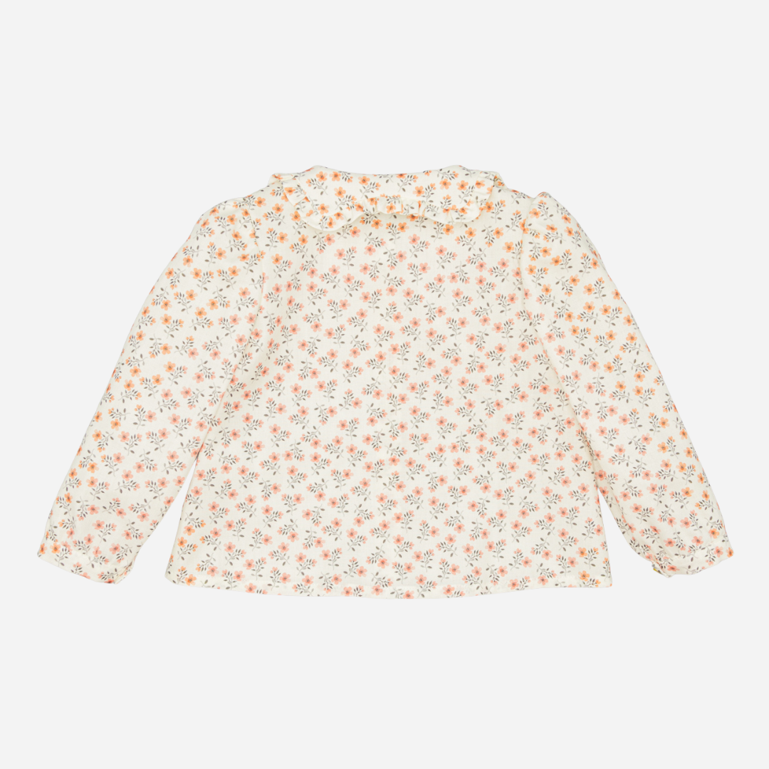 Sold at Bombon shop, designed by Fina Ejerique, floral viyella blouse with ruffled collar, pairs perfectly with the beige textured skirt and pink vest. back