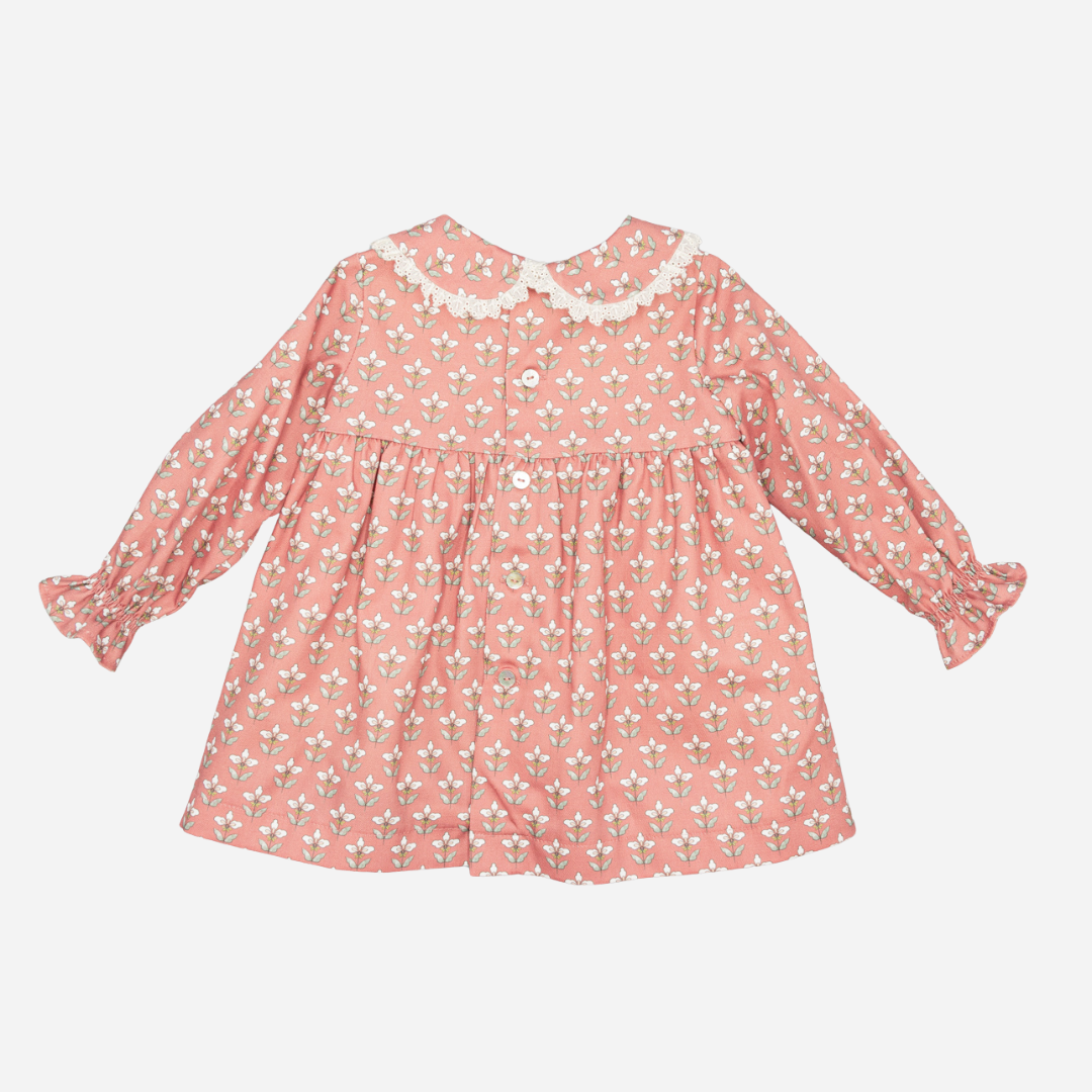 Sold at Bombon shop, designed by Fina Ejerique, a coral-pink floral baby dress with lace-trim collar and long sleeves. back