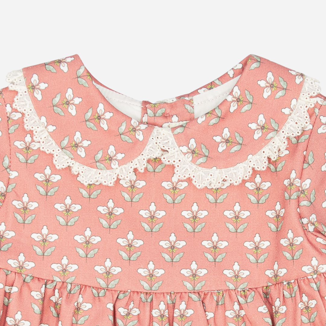 Sold at Bombon shop, designed by Fina Ejerique, a coral-pink floral baby dress with lace-trim collar and long sleeves. zoom