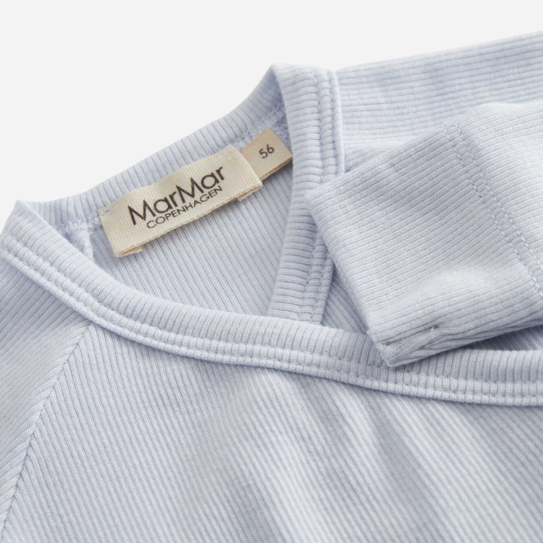 Sold at Bombon shop, designed by Mar Mar Copenhagen, Rubello modal footed baby onesie in Blue Mist ribbed fabric