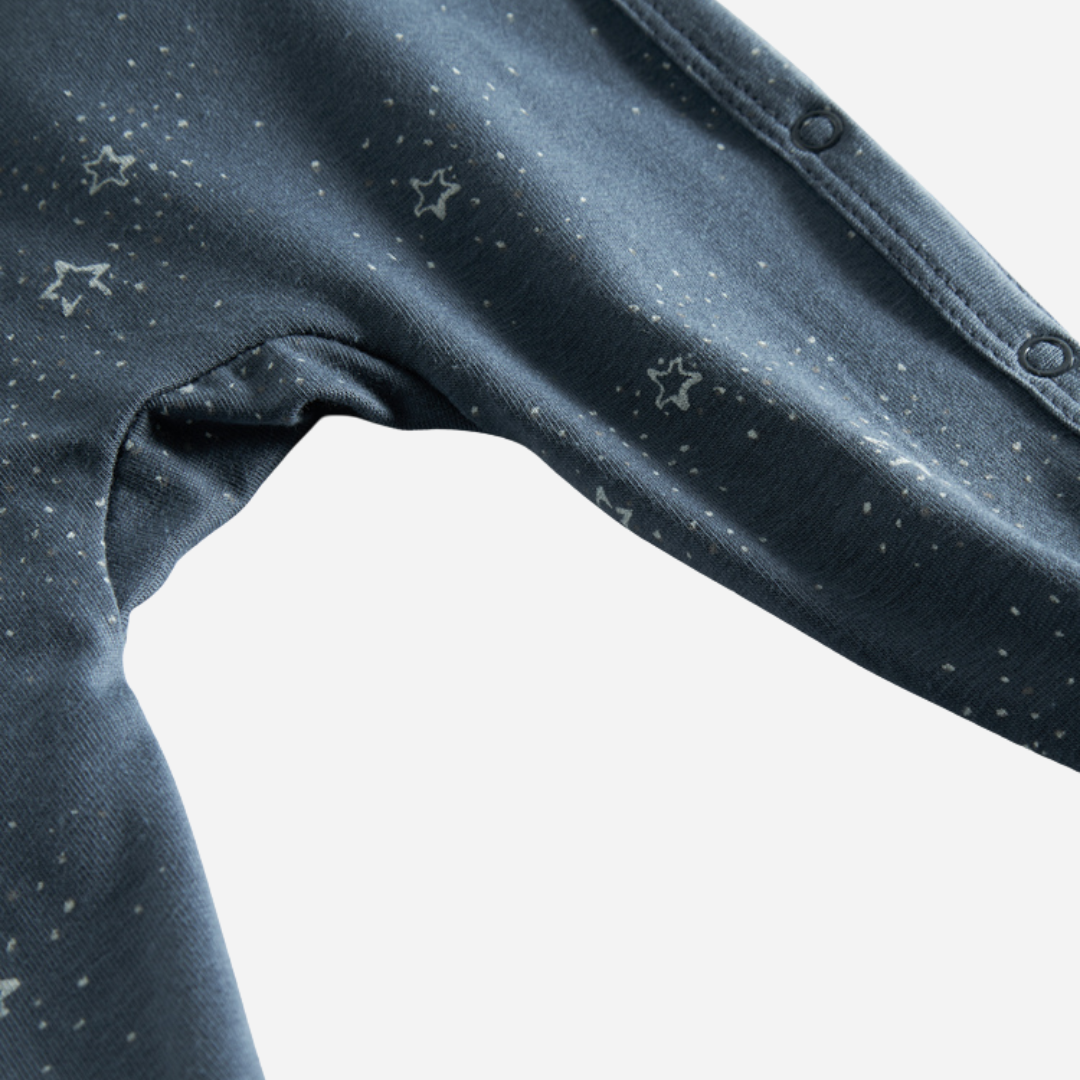 Sold at Bombon shop, designed by MarMar Copenhagen. Midnight blue baby wrap footie with white star print, pairs perfectly with the matching hat and blanket.