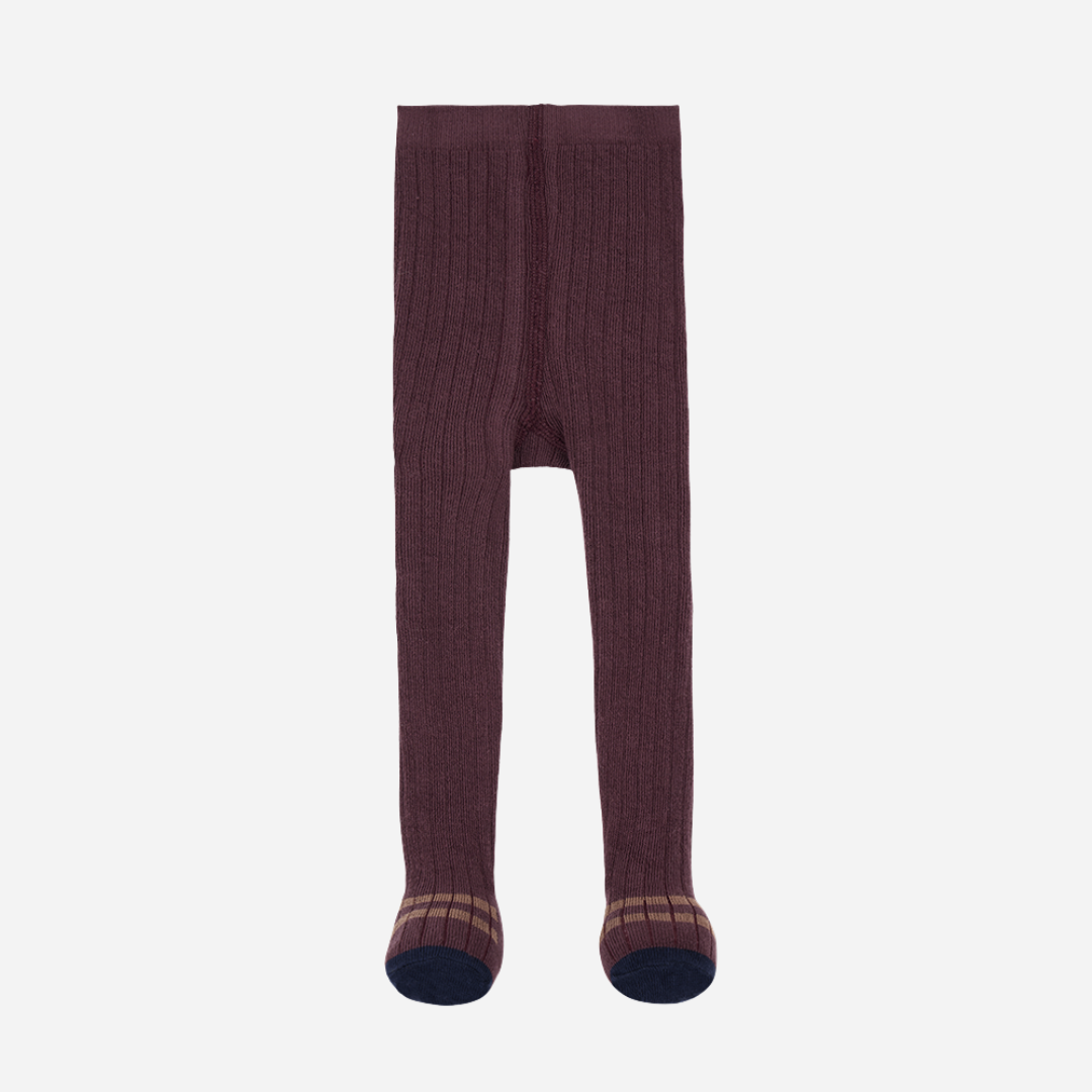 Sold at Bombon shop, designed by 1+ in the family — ribbed knit baby tights in melanzana with contrast navy toes and tan stripe detail.