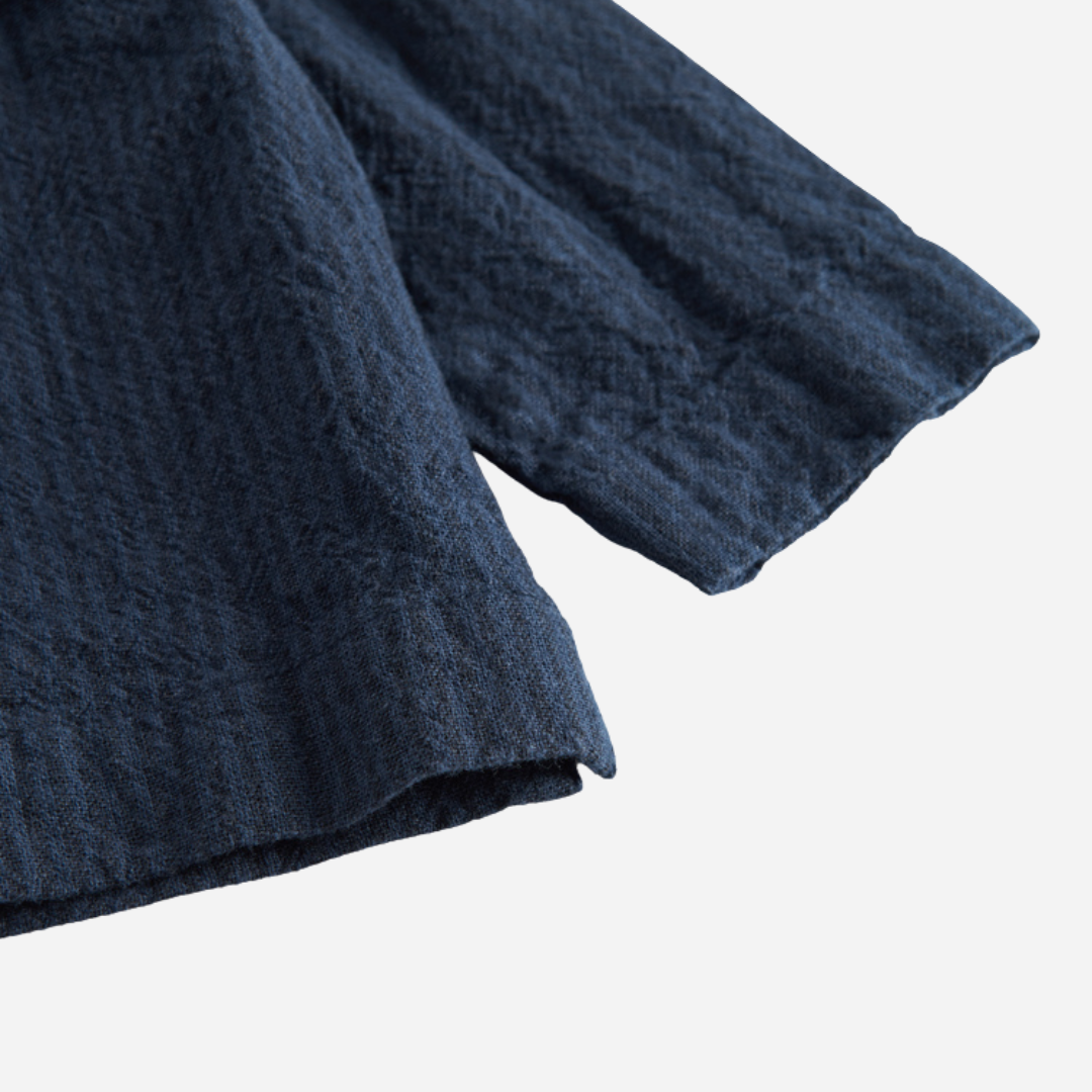 Sold at Bombon shop, designed by MarMar Copenhagen — navy 100% cotton textured long-sleeve baby shirt with buttons, part of a matching set