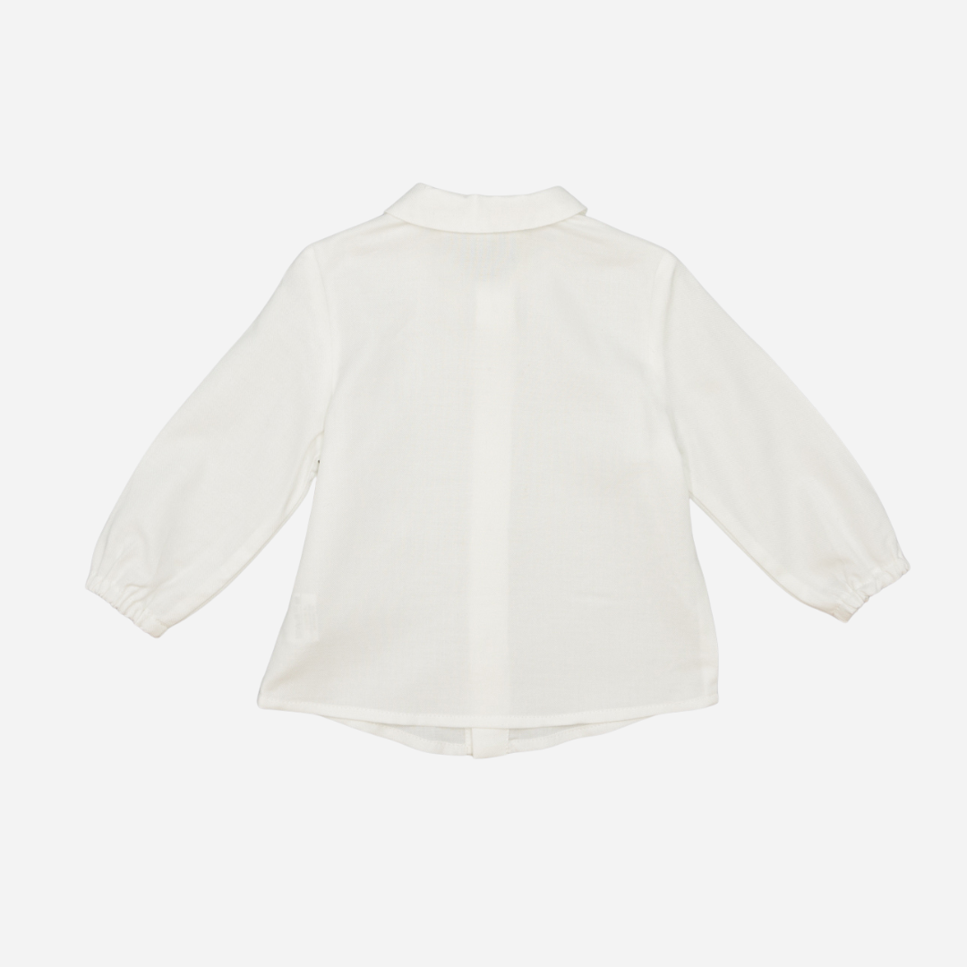 Sold at Bombon shop, designed by Fina Ejerique, a white viyella baby shirt with rounded collar, wooden buttons, and long sleeves. back