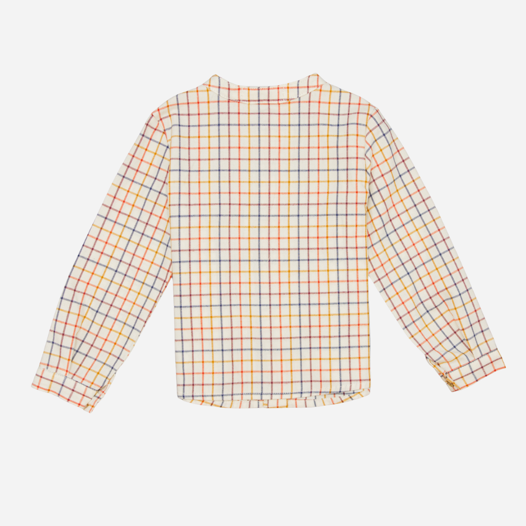 Sold at Bombon shop, designed by Fina Ejerique, a beige viyella baby shirt with red, mustard, and blue checkered pattern, wooden buttons, and long sleeves. back
