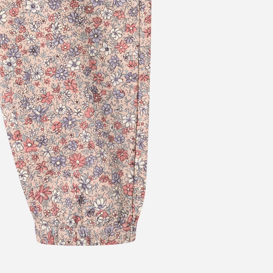 Sold at Bombon shop, designed by Wheat, these floral print pants feature an elastic waist and cuffs in soft rose and lavender tones. leg
