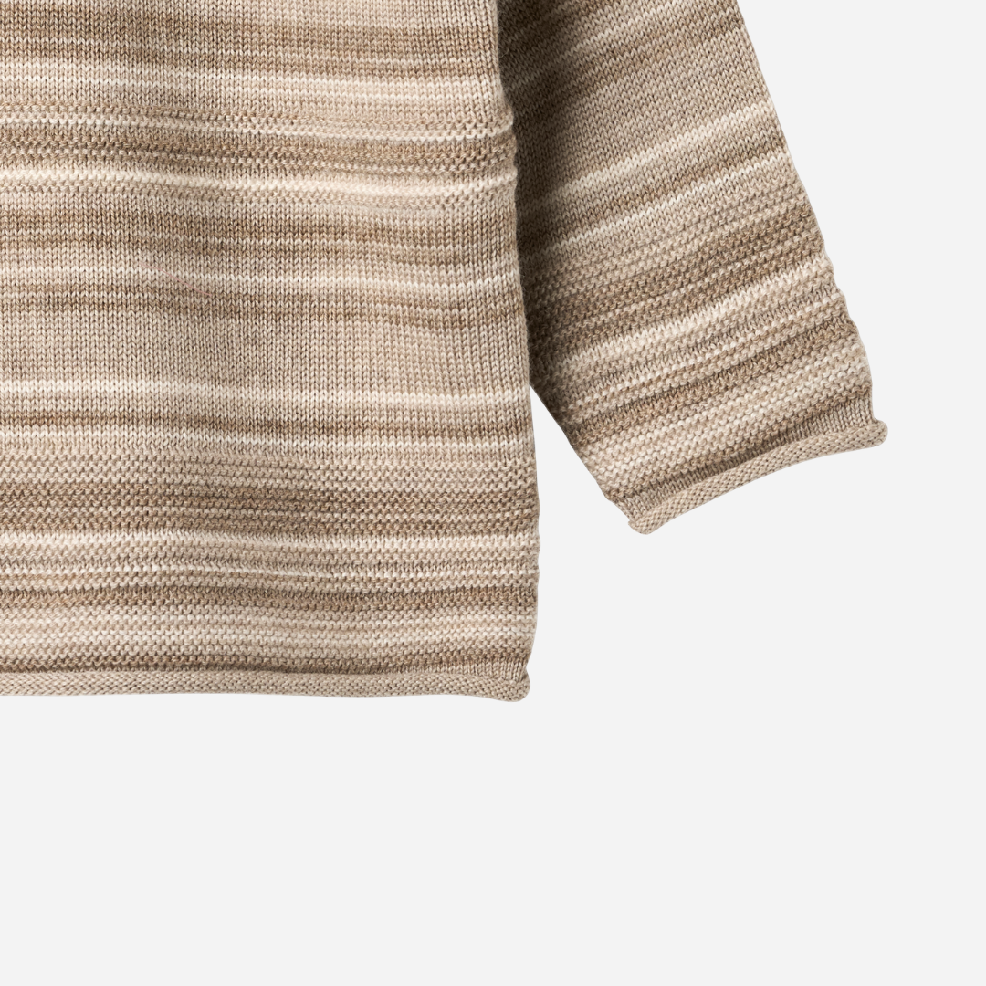 Sold at Bombon shop, designed by Wheat — knit baby sweater in warm sand stripe with shoulder buttons and soft texture. bottom