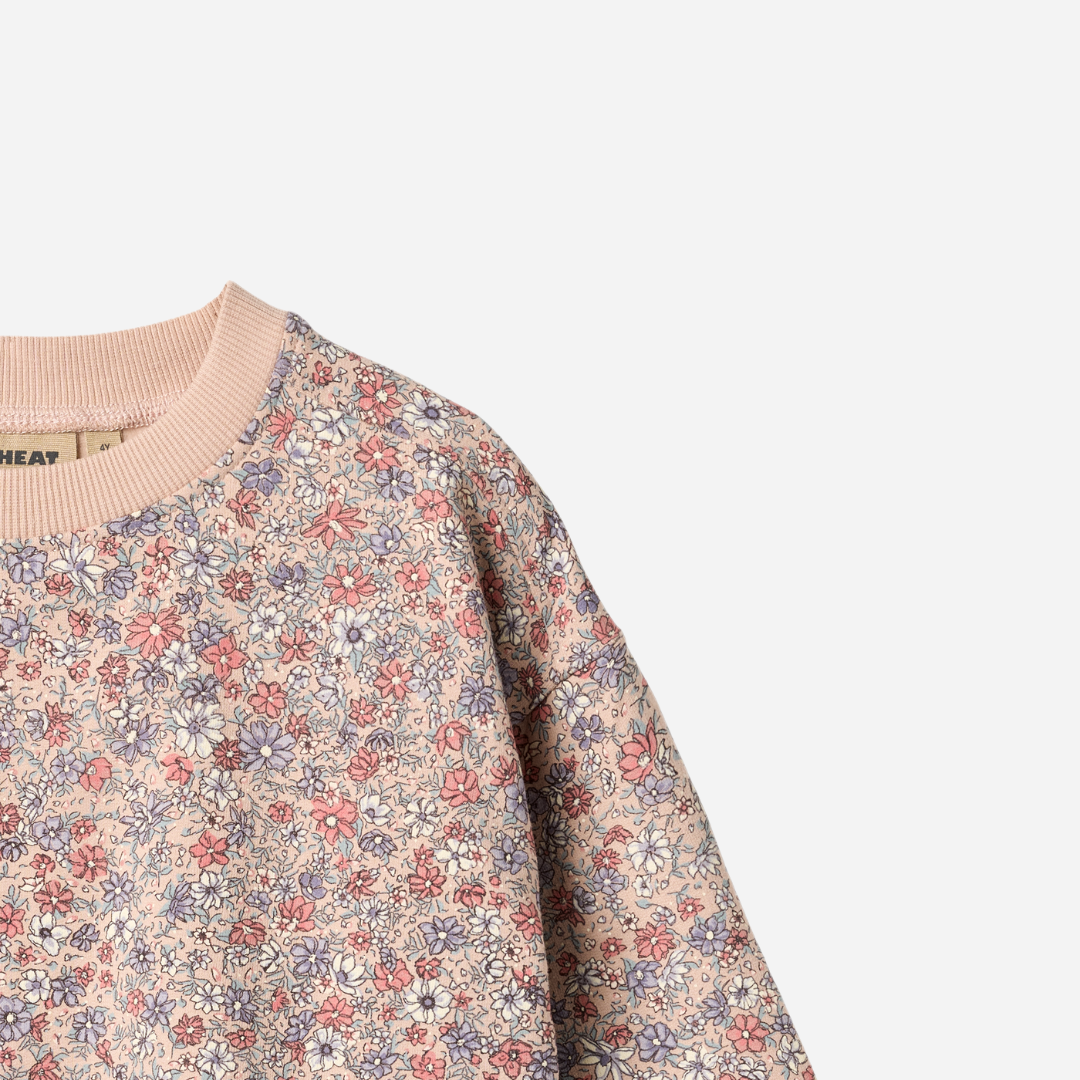 Sold at Bombon shop, designed by Wheat, this floral sweatshirt features a vintage-inspired allover print and soft ribbed cuffs. top