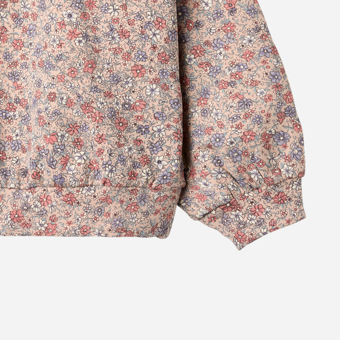Sold at Bombon shop, designed by Wheat, this floral sweatshirt features a vintage-inspired allover print and soft ribbed cuffs. sleeve