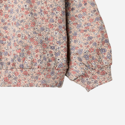 Sold at Bombon shop, designed by Wheat, this floral sweatshirt features a vintage-inspired allover print and soft ribbed cuffs. sleeve
