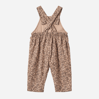 Sold at Bombon shop, designed by Wheat, this baby overall features an allover black sea garden floral print with adjustable button straps and snap closures along the inseam. back