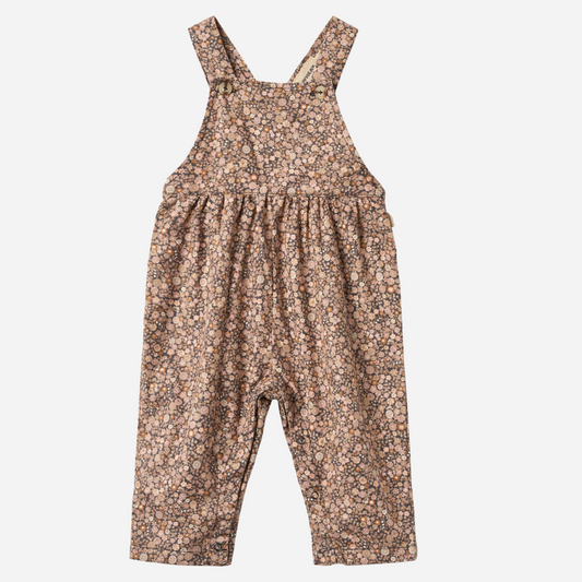 Sold at Bombon shop, designed by Wheat, this baby overall features an allover black sea garden floral print with adjustable button straps and snap closures along the inseam. front
