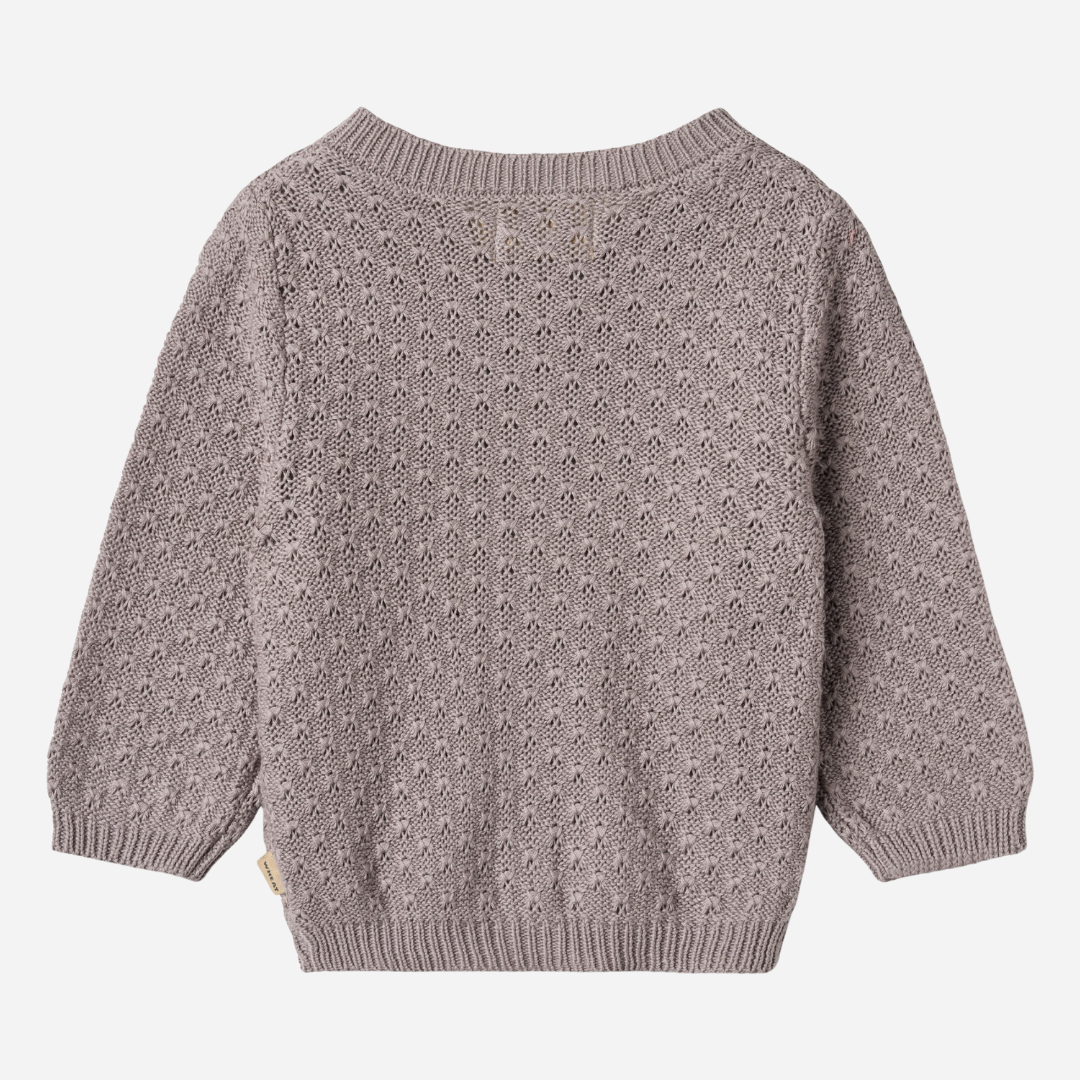 Sold at Bombon shop, designed by Wheat, this dusty purple pointelle cardigan features wooden buttons and a cozy knit texture. back