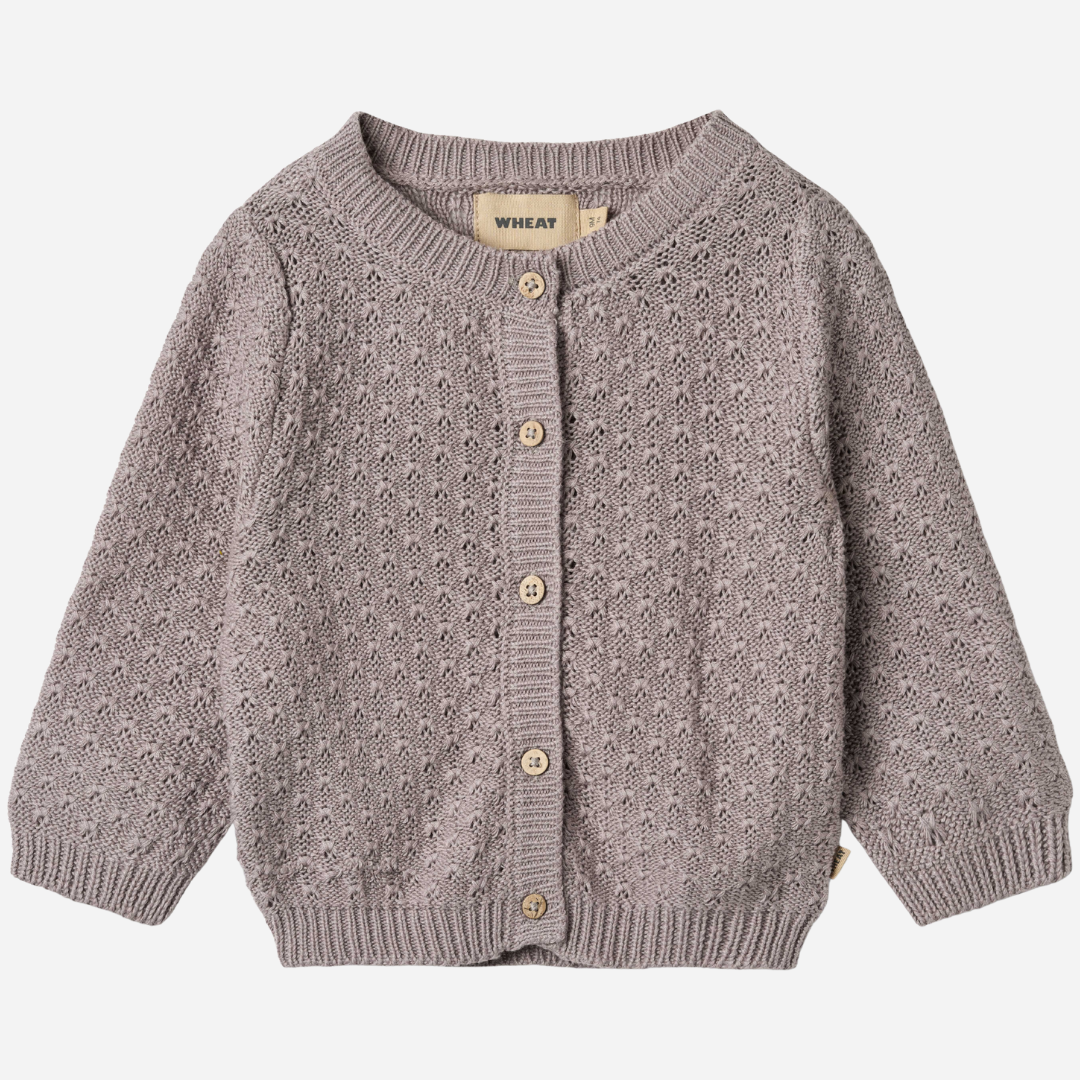 Sold at Bombon shop, designed by Wheat, this dusty purple pointelle cardigan features wooden buttons and a cozy knit texture. front