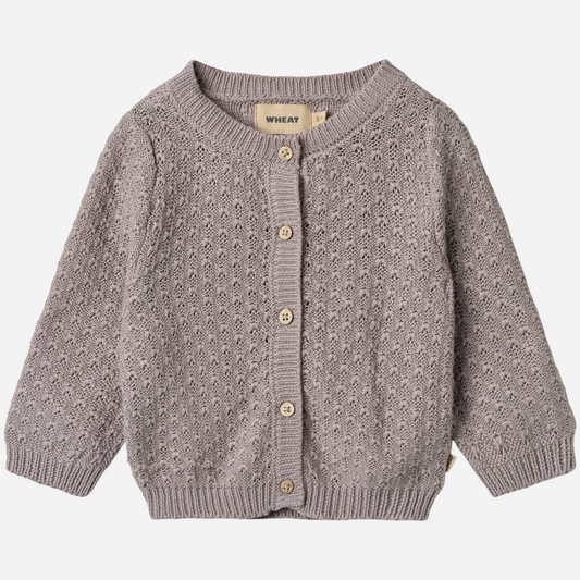 Sold at Bombon shop, designed by Wheat, this dusty purple pointelle cardigan features wooden buttons and a cozy knit texture. front