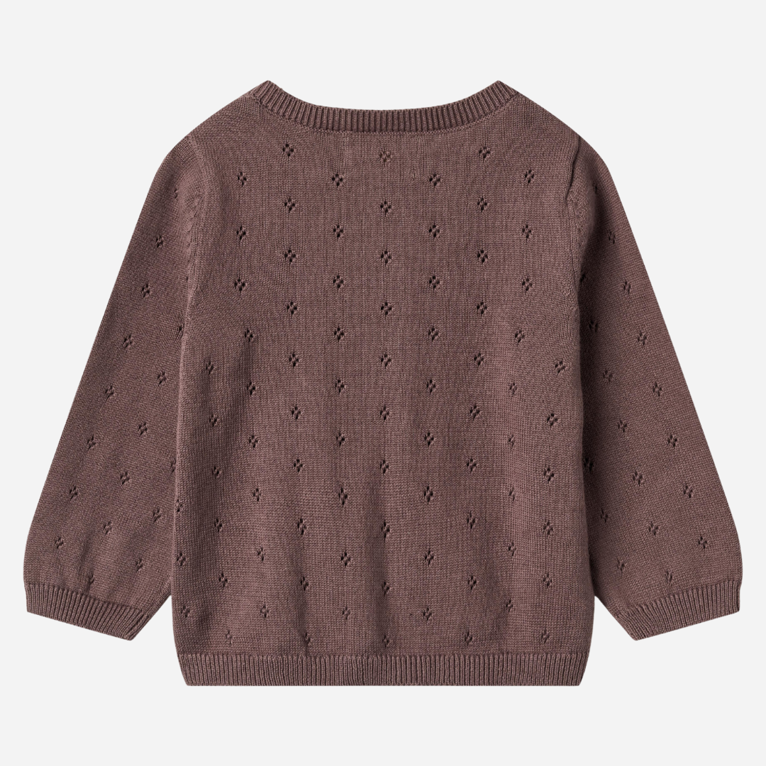 Sold at Bombon shop, designed by Wheat — plum-colored baby cardigan with delicate pointelle knit pattern, front button closure, and ribbed edges. back