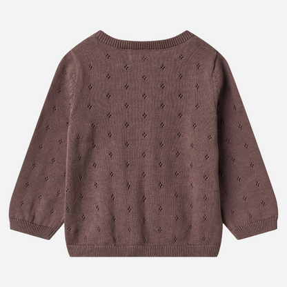 Sold at Bombon shop, designed by Wheat — plum-colored baby cardigan with delicate pointelle knit pattern, front button closure, and ribbed edges. back
