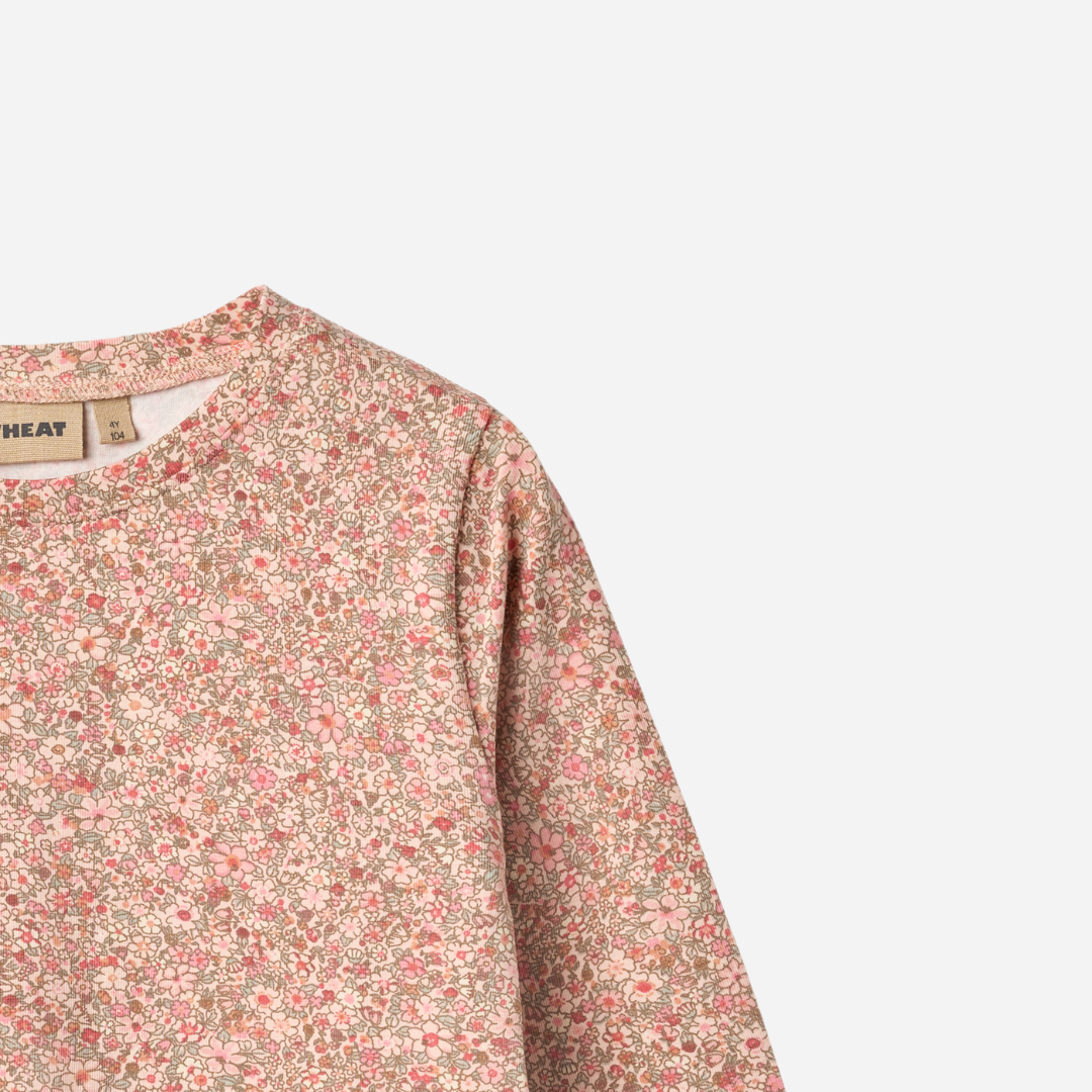 Sold at Bombon shop, designed by Wheat, this long-sleeve top features a delicate dusty pink floral print on a soft cotton blend. zoom top