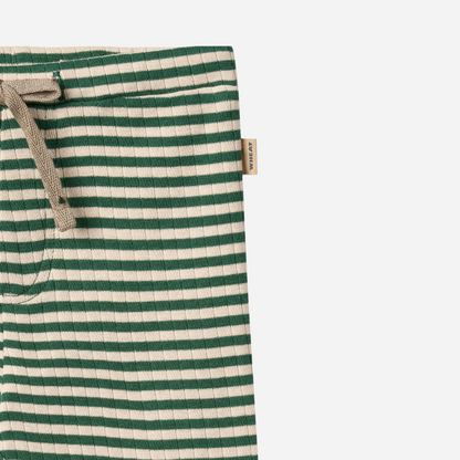 Sold at Bombon shop, designed by Wheat, green and cream striped ribbed baby pants with an elastic waist and drawstring tie. top