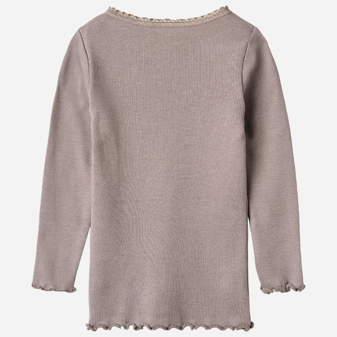 Sold at Bombon shop, designed by Wheat, this dusty purple ribbed long-sleeve tee features ruffle edges and a soft, stretchy finish. back