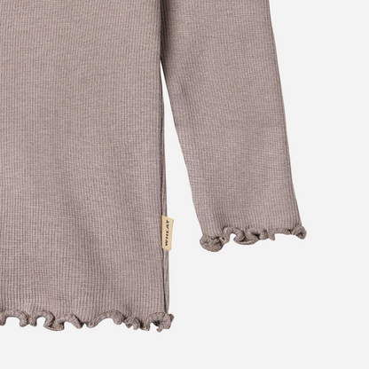 Sold at Bombon shop, designed by Wheat, this dusty purple ribbed long-sleeve tee features ruffle edges and a soft, stretchy finish. bottom
