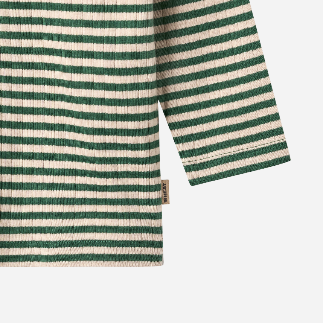 Sold at Bombon shop, designed by Wheat — forest green and cream striped ribbed long-sleeve top with shoulder snaps. bottom