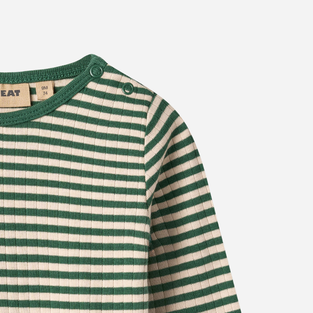 Sold at Bombon shop, designed by Wheat — forest green and cream striped ribbed long-sleeve top with shoulder snaps. top