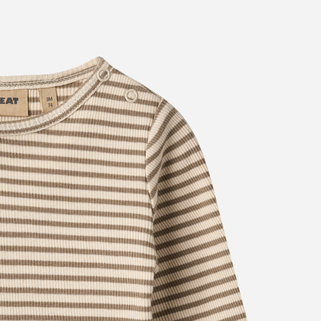 Sold at Bombon shop, designed by Wheat — ribbed long-sleeve top with stone and cream stripes and shoulder snap detail. top