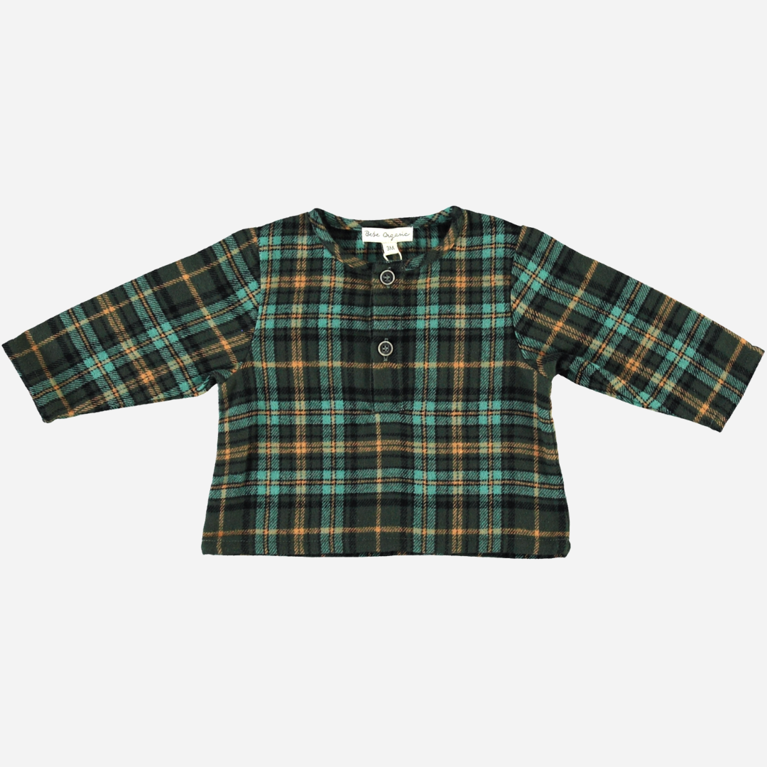 Sold at Bombon Shop, this Bebe Organic baby and toddler boy top features a classic green and gold plaid pattern, crafted from soft organic cotton flannel with long sleeves and a front button detail — a cozy and timeless piece perfect for layering during the fall and winter seasons.