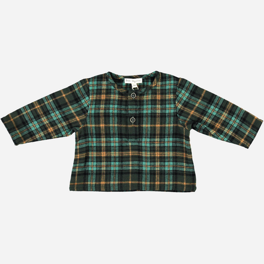 Sold at Bombon Shop, this Bebe Organic baby and toddler boy top features a classic green and gold plaid pattern, crafted from soft organic cotton flannel with long sleeves and a front button detail — a cozy and timeless piece perfect for layering during the fall and winter seasons.