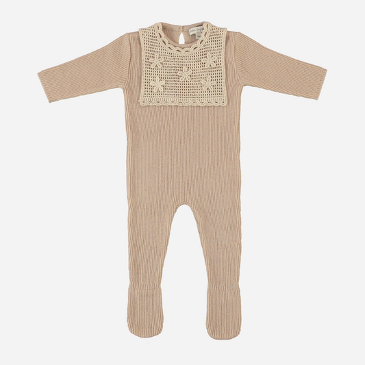Sold at Bombon Shop, this Bebe Organic baby footed romper is crafted from soft ribbed organic cotton in a warm taupe hue, featuring a delicate hand-crocheted bib with floral embroidery and long sleeves — a cozy and elegant one-piece perfect for newborn gifting and everyday comfort.
