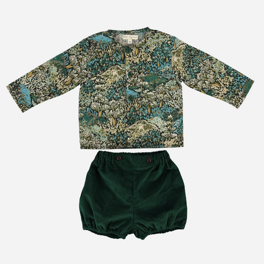 Sold at Bombon Shop, this Bebe Organic outfit for baby and toddler boys includes a long-sleeve top with a whimsical forest-inspired print in earthy green and teal tones, paired with dark green corduroy bloomers — a charming, organic cotton set perfect for fall and winter dressing with a touch of storybook magic.