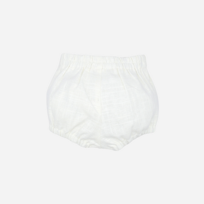 Sold at Bombon shop, designed by Fina Ejerique brand, white linen button shorts for baby perfect for spring and summer. Back view